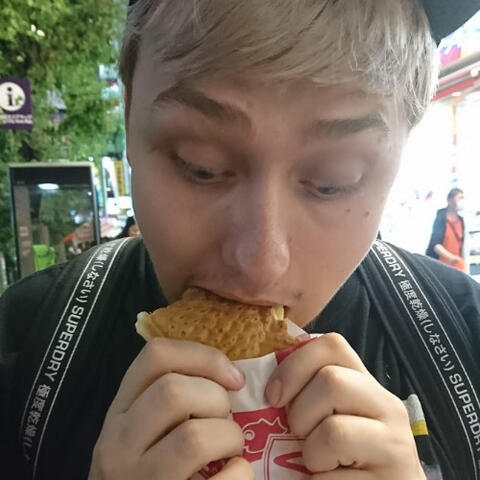 a picture of me chompin' down on a nice taiyaki in tokyo